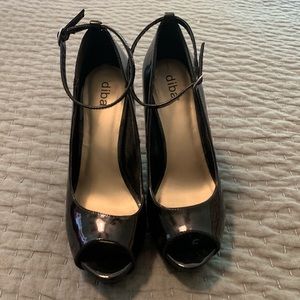 Black patent leather platform stilettos.